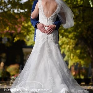 Beaded Lace Wedding Dress with Illusion Neckline & Intricate Floral Embroidery.
